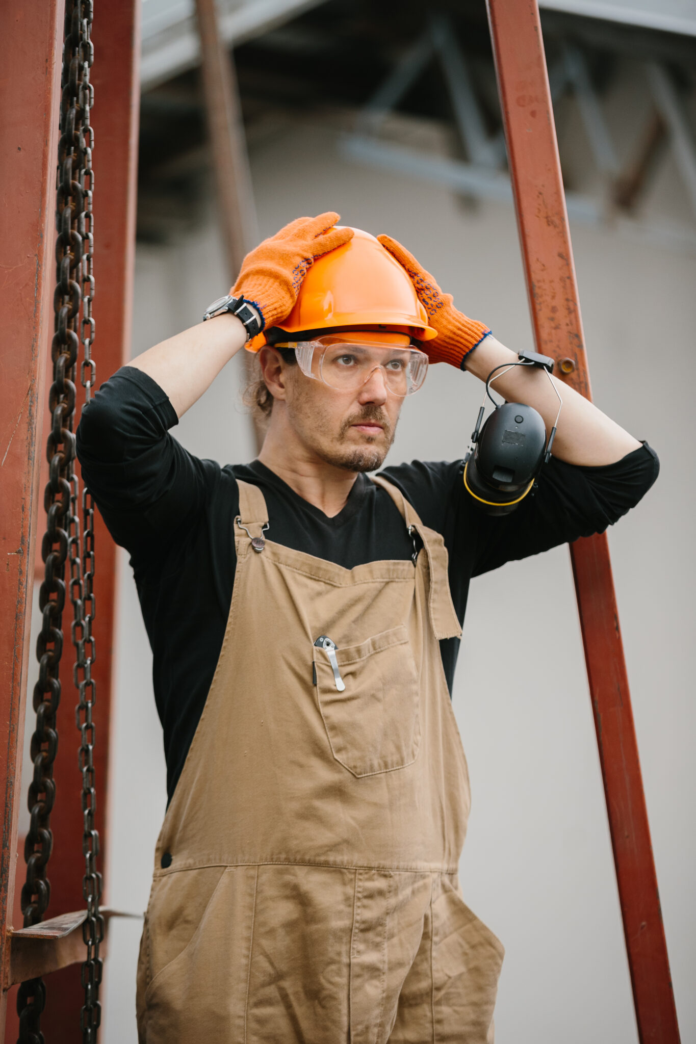 Construction worker in hi-vis and hard hat on a British Columbia job site.
