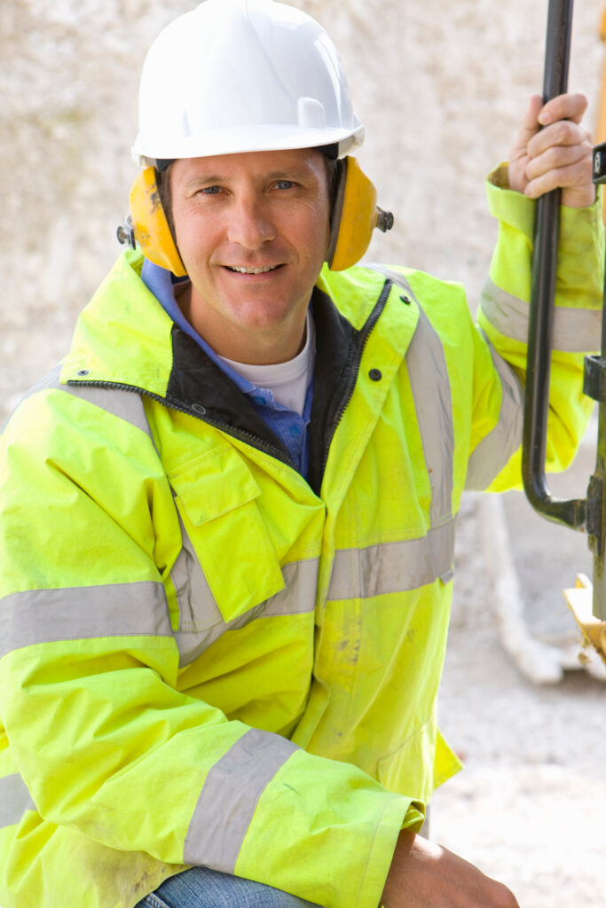 Close-up portrait of a construction worker on a job site.